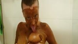 Gorgeous scat girl completely covers her body with shit in the bathroom